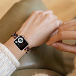 Oval resin replacement strap for Apple Watch in a colorful design, worn on a wrist, showcasing its style and comfort.