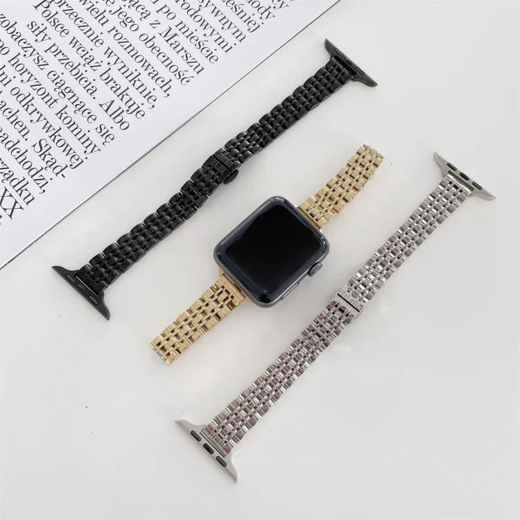Three steel replacement straps for Apple Watch, showcasing black, gold, and silver options next to a watch face.