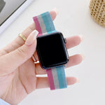 Milanese replacement strap for Apple Watch, four-color design shown on wrist, compatible with multiple watch sizes.