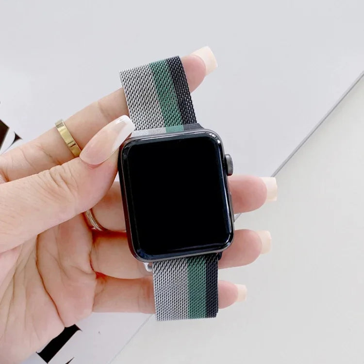 Milanese replacement strap for Apple Watch displayed on a hand, showcasing a stylish four-color design.