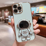 Capa para telemóvel com suporte de astronauta eletroplatinado, para iPhone 17e / 16e, para iPhone 17 Pro Max, para iPhone 17 Pro, para iPhone 17, para iPhone Air, para iPhone 16 Pro Max, para iPhone 16 Pro, para iPhone 16 Plus