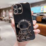 Capa para telemóvel com suporte de astronauta eletroplatinado, para iPhone 17e / 16e, para iPhone 17 Pro Max, para iPhone 17 Pro, para iPhone 17, para iPhone Air, para iPhone 16 Pro Max, para iPhone 16 Pro, para iPhone 16 Plus