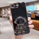 Capa para telemóvel com suporte de astronauta eletroplatinado, para iPhone 17e / 16e, para iPhone 17 Pro Max, para iPhone 17 Pro, para iPhone 17, para iPhone Air, para iPhone 16 Pro Max, para iPhone 16 Pro, para iPhone 16 Plus