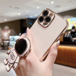 Capa para telemóvel com suporte de astronauta eletroplatinado, para iPhone 17e / 16e, para iPhone 17 Pro Max, para iPhone 17 Pro, para iPhone 17, para iPhone Air, para iPhone 16 Pro Max, para iPhone 16 Pro, para iPhone 16 Plus