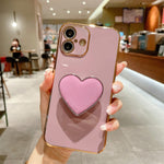 Capa para telemóvel TPU com suporte em forma de coração electroplated, para iPhone 17e / 16e, para iPhone 17 Pro Max, para iPhone 17 Pro, para iPhone 17, para iPhone Air, para iPhone 16 Pro Max, para iPhone 16 Pro, para iPhone 16 Plus