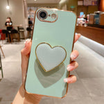 Capa para telemóvel TPU com suporte em forma de coração electroplated, para iPhone 17e / 16e, para iPhone 17 Pro Max, para iPhone 17 Pro, para iPhone 17, para iPhone Air, para iPhone 16 Pro Max, para iPhone 16 Pro, para iPhone 16 Plus